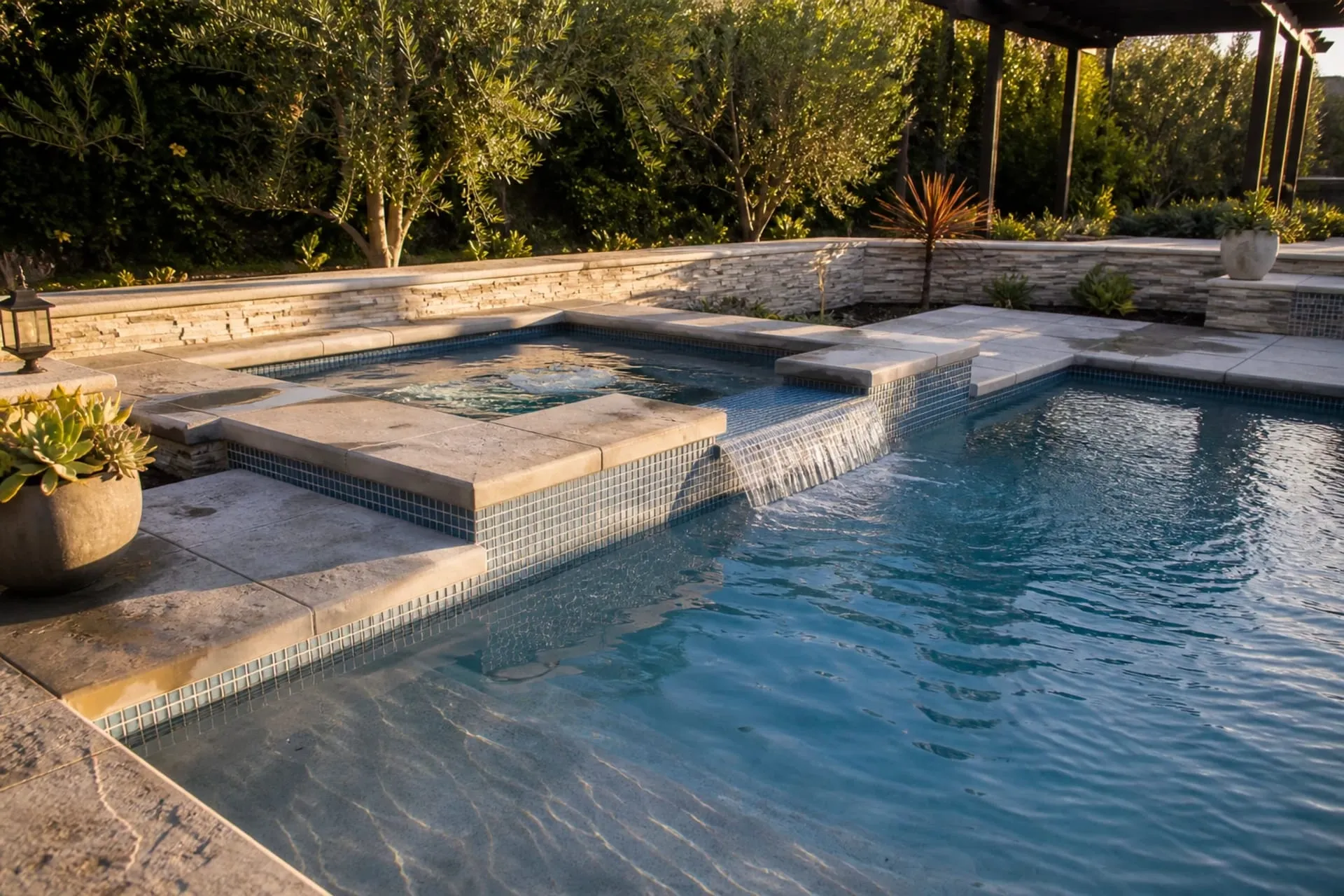A clean spa with a spillover into the main pool