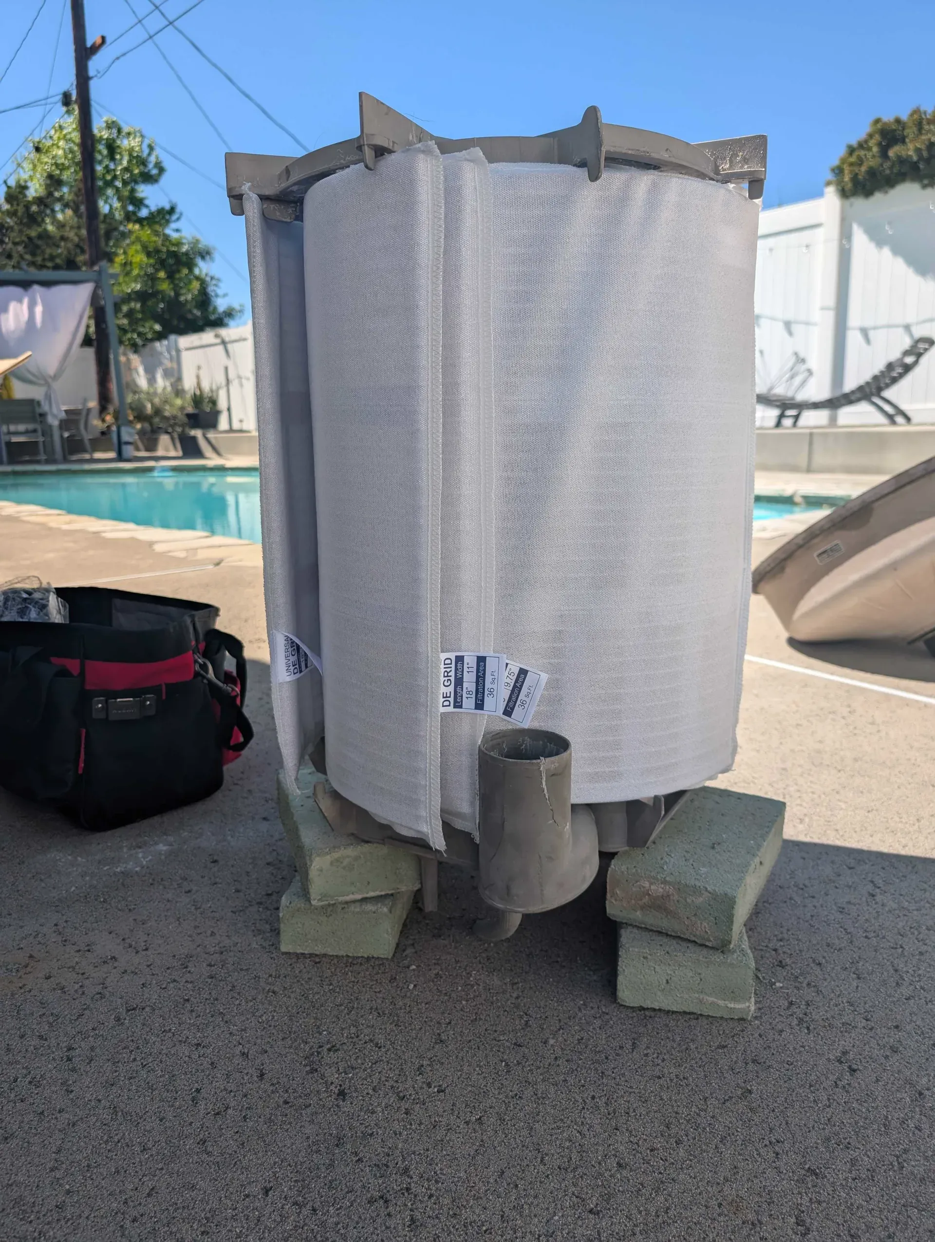 A new DE grid filter element resting poolside before it goes into the filter housing
